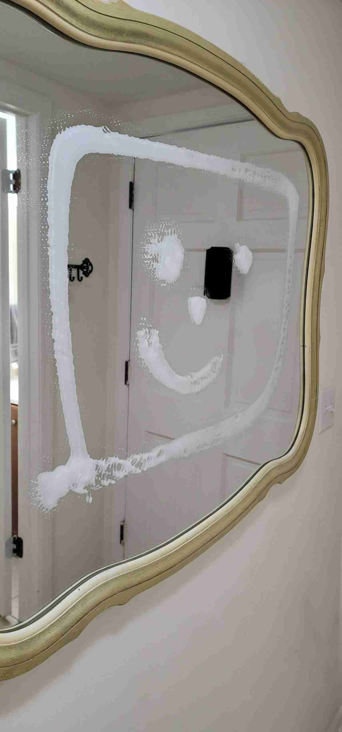 Clean Glass Mirror with Smiley Face